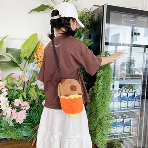 Cute Capybara plush crossbody bag with adjustable strap shown on a model for scale