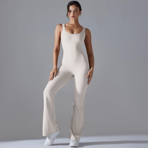 Close-up of sleeveless beige yoga jumpsuit with U-neck design and flared leg cut