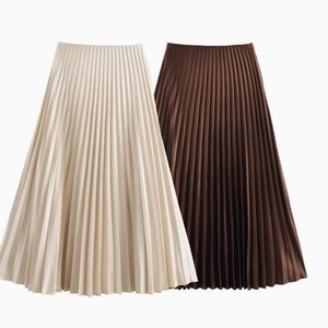Elegant high-waisted pleated midi skirts shown in cream white and dark coffee colors