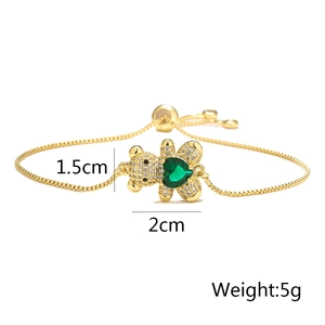 Detail view showing dimensions of golden bear bracelet with green heart stone inlay