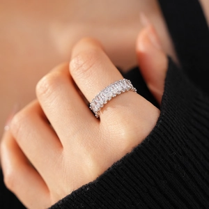 Detailed macro view of an eternity band ring with marquise-cut cubic zirconia stones
