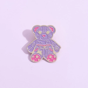 Graffiti style cartoon bear enamel pin with heart and star patterns on lilac background