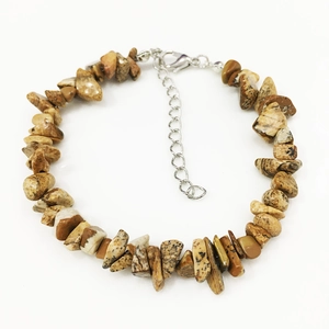 Detailed macro view of natural picture jasper stone bracelet with lobster clasp