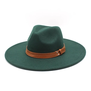Detail of dark green wool fedora hat featuring a brown leather band with silver rivets