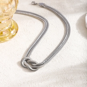 Minimalist silver stainless steel snake chain necklace with a centered knot design