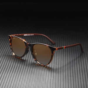 Detail of polarized sunglasses showing tortoiseshell frame and KDEAM logo on temple