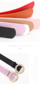 Detail of round buckle with embedded pearls on elegant leather waist belts in various colors