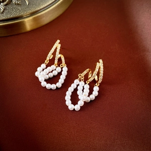 Vintage gold layered earrings with sparkling zircons and elegant white pearl tassels