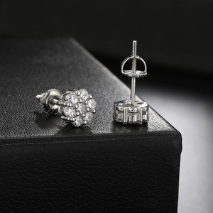 Macro detail of silver flower stud earrings with clear stones and screw back closure