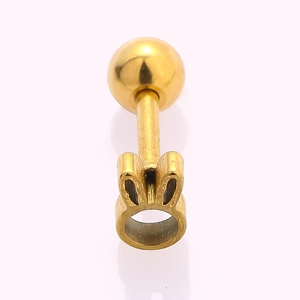 Macro view of gold-plated 316L stainless steel bunny ear cartilage stud with screw ball