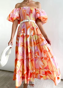 Detail of off-shoulder floral maxi dress with tiered skirt and woven white belt