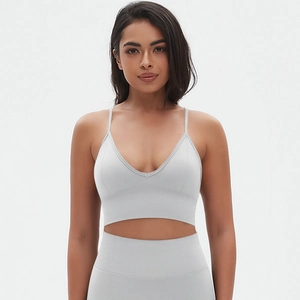 Detailed close-up of seamless light grey sports bra with V-neck and thin shoulder straps