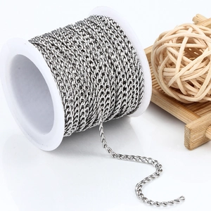 Roll of stainless steel Cuban link chain for DIY jewelry making on white spool