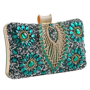 Emerald green evening clutch bag with peacock feather rhinestone design and silver frame