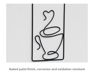 Detail of black iron wall art with anti-corrosion paint and coffee cup wire design