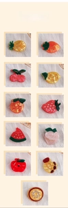 Detailed grid view showing various fruit-shaped hair clips with glossy finish