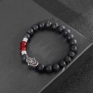 Lava rock stone beaded bracelet with red crystal beads and silver Hamsa hand charm
