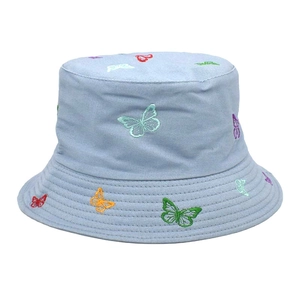 Close-up of colorful butterfly embroidery details on light blue cotton bucket hat