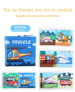 Close-up of baby cloth book interior showing colorful vehicle patterns and English words
