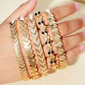 Luxury gold bracelet set for women featuring V-shapes, hearts, and zircon stones