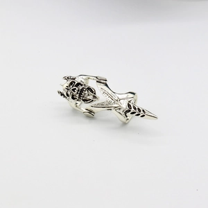 Detail of vintage silver mechanical skull ring with articulated joints and gothic finish