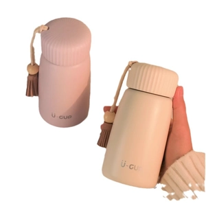 Mini portable stainless steel insulated water bottle with decorative tassel in pastel colors