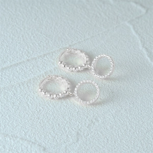 Detailed close-up of S925 silver hoop earrings featuring double circles and 5A cubic zirconia