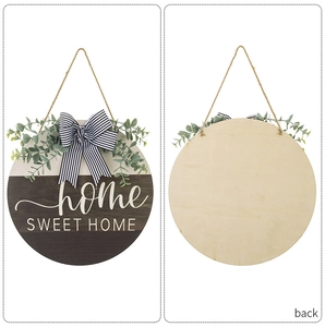 Front and back detail of a round wooden Home Sweet Home door sign with eucalyptus and bow
