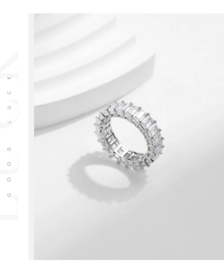 Macro shot of S925 sterling silver eternity ring with emerald-cut sparkling crystals