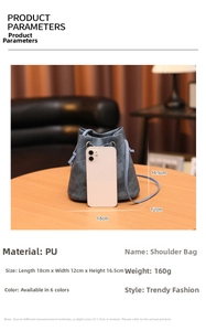 Detailed size view of dusty blue drawstring bucket bag with mobile phone comparison
