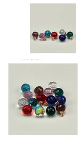 Detailed macro view of multi-colored faceted crystal glass buttons with gold metal loops