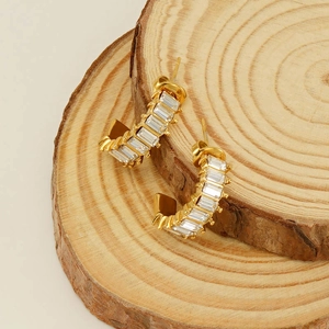 U-shaped gold stainless steel earrings featuring channel-set rectangular zircon stones