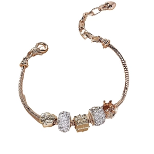 Rose gold snake chain bracelet with heart charm, bear bead, crown and sparkling crystals