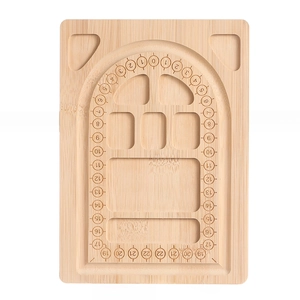 Detailed macro view of a bamboo bead design board with circular measurement scale grooves