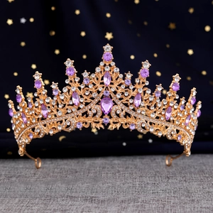 Detail view of Baroque crown with purple crystals and gold metal base for weddings