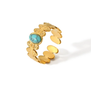 Detail of 18K gold stainless steel open ring with oval turquoise and leaf texture