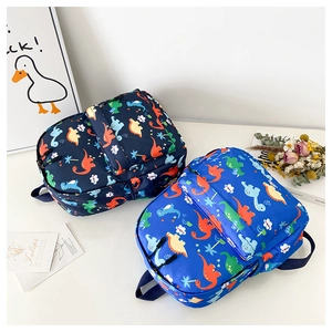 Detail of waterproof dinosaur backpacks for kids in dark and bright blue colors