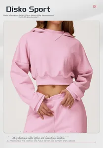 Pink cropped hoodie and matching sweatpants set with soft knit texture on model