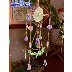 Detailed suncatcher view with green raw crystal, moon charms, and rainbow prism beads