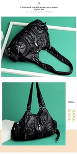 Detail of black vintage punk bag with glossy pleated texture and metal zippers