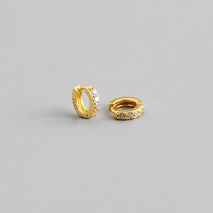 Detailed macro view of S925 sterling silver gold earrings with small zircons