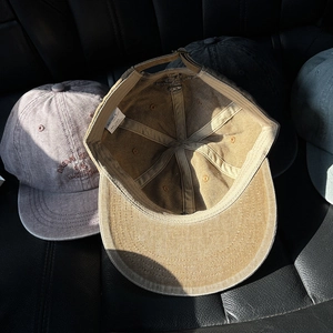 Retro washed canvas baseball hats with Dream Big embroidery in multi-color options