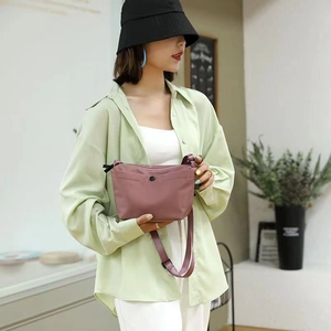 Minimalist lavender nylon dumpling crossbody bag for women with adjustable strap