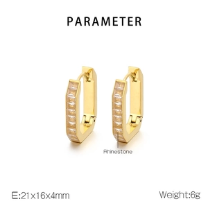 Detail view of gold U-shaped earrings with rhinestone inlay including size and weight info