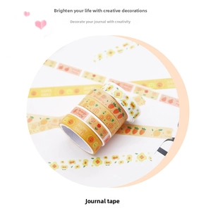 Close-up of 5 rolls of washi tape with watercolor fruit and geometric DIY patterns