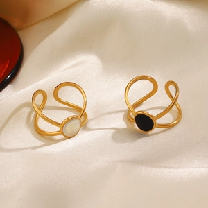 18K gold-plated stainless steel oval rings with black and white drip oil on silk surface