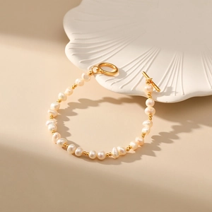 Elegant natural freshwater pearl bracelet with 18K gold plated OT clasp and gold beads
