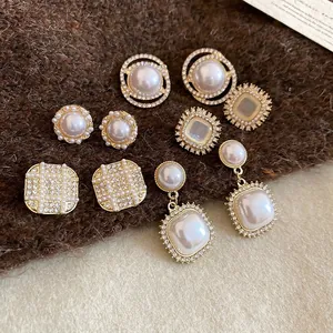 Detailed set of five vintage French style pearl and rhinestone gold-tone earrings
