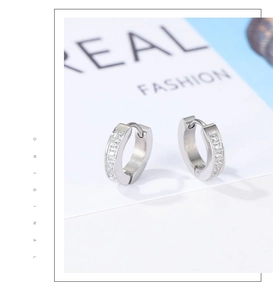Detail of silver stainless steel hoop earrings with double-row white zircon inlay