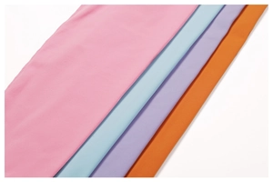 Detail view of four lightweight yoga pants fabrics in pink, blue, purple, and orange